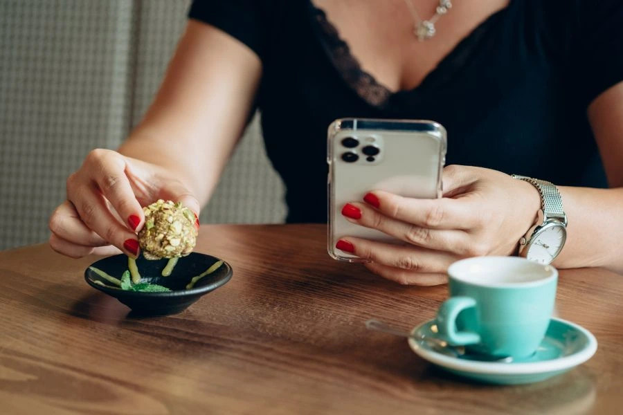 Woman eating a small protein bite
